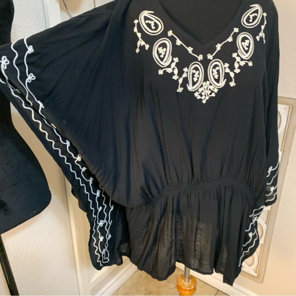 Westbound black with white embroidered design and butterfly wings arms. Size 3X